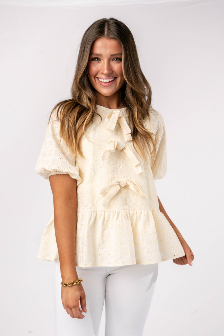 Eyelet Front Bow Peplum Top