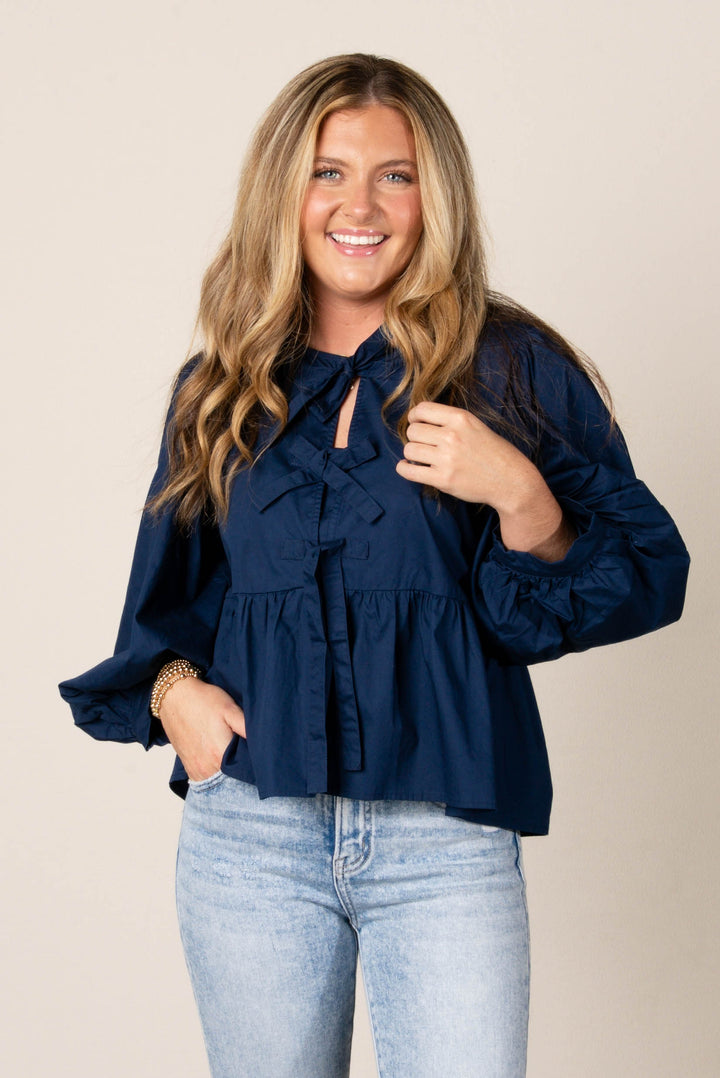 Bow Front Peplum Long Sleeve Top in Navy