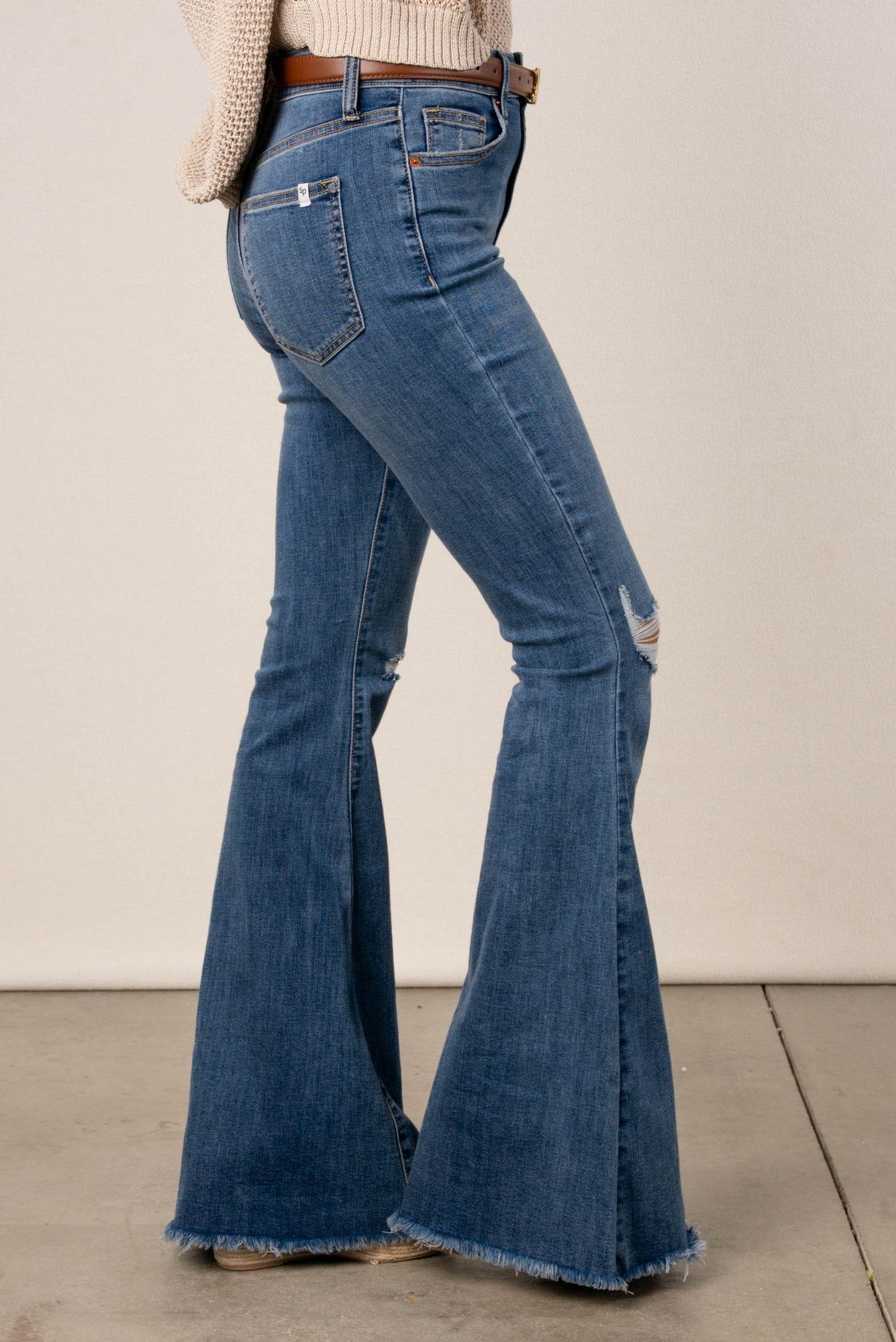 Sneak Peek High Rise Flare Jeans