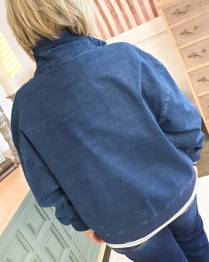 Back view of the navy washed pullover with a relaxed fit and dropped shoulders