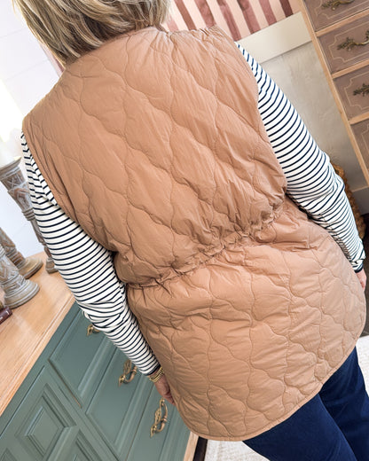 Back view of the tan quilted vest with diamond stitching and cinched drawstring waist