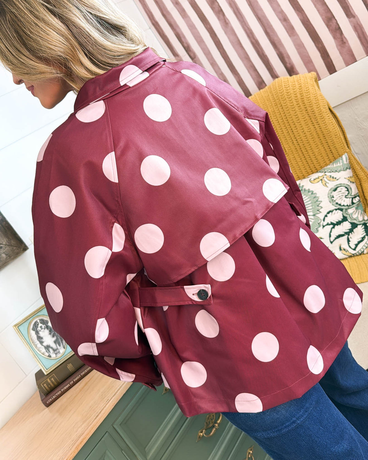 Back view of the burgundy jacket with large pink polka dots